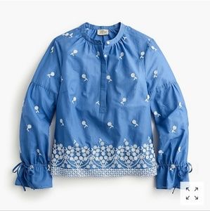Embroidered floral popover shirt.